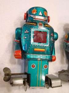 pair of vintage tin toys, wind up mechanical Mighty Robots, circa 
