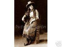 PHOTO OF A PRETTY COWGIRL WITH HER PISTOL,HAT & HOLSTER  