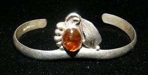 Lee Charley Navajo sterling cuff w organic figure amber  